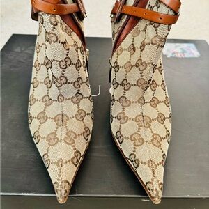 Authentic Gucci GG monogram boots with gold buckle 36B